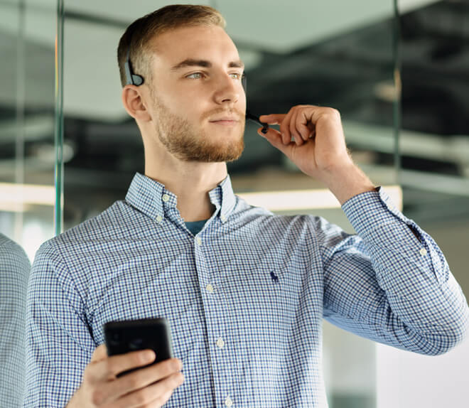 A man wearing EDIFIER CC200 wireless mono headset 