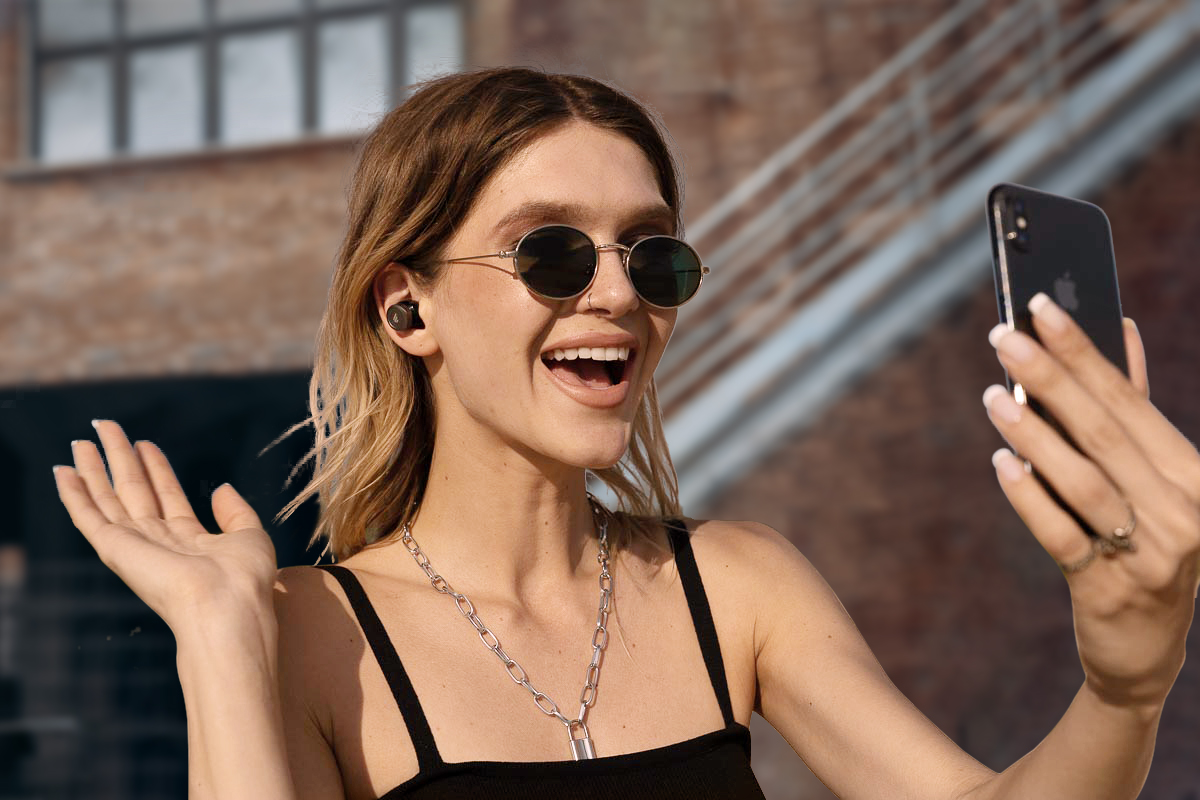 A woman calling with edifier bluetooth earbuds