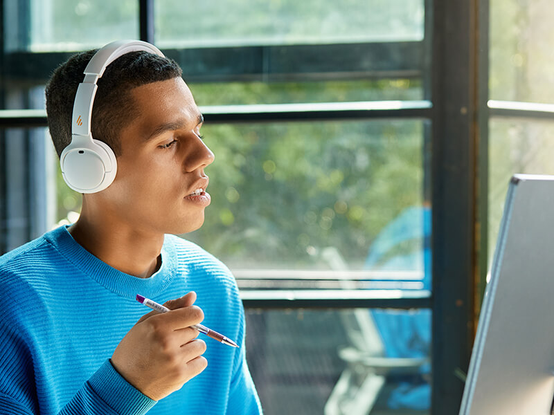 A girl wearing bluetooth earbuds