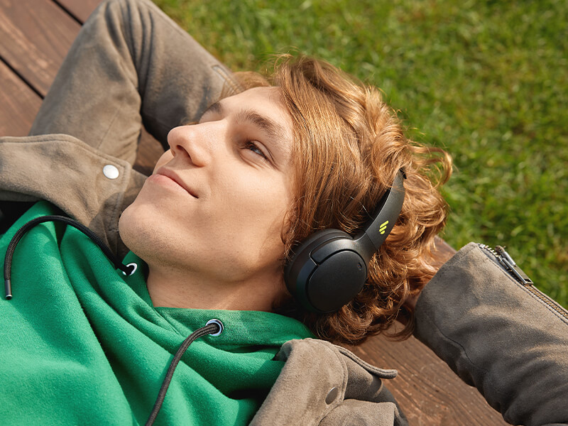 the man holding edifier white earbuds in the hand